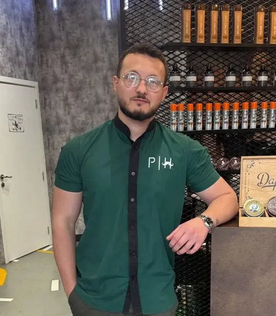 Hussein the Style Master barber specializing in all hair types at Dubai barbershop