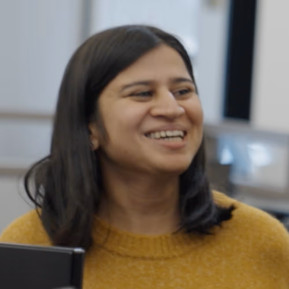 A smiling woman at an office.
