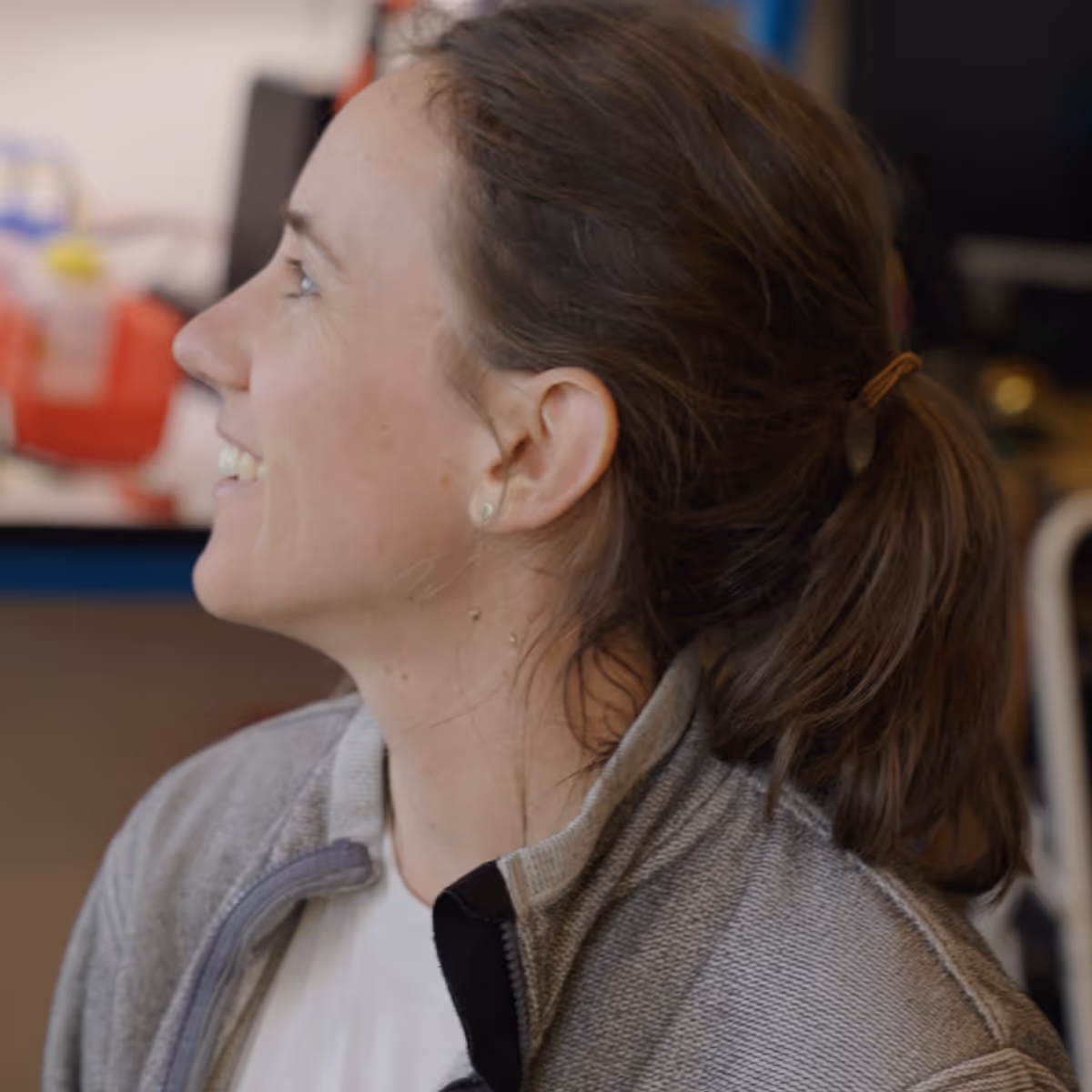 A happy young woman at work.