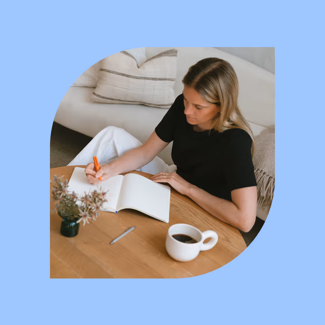 a woman writing in a notebook