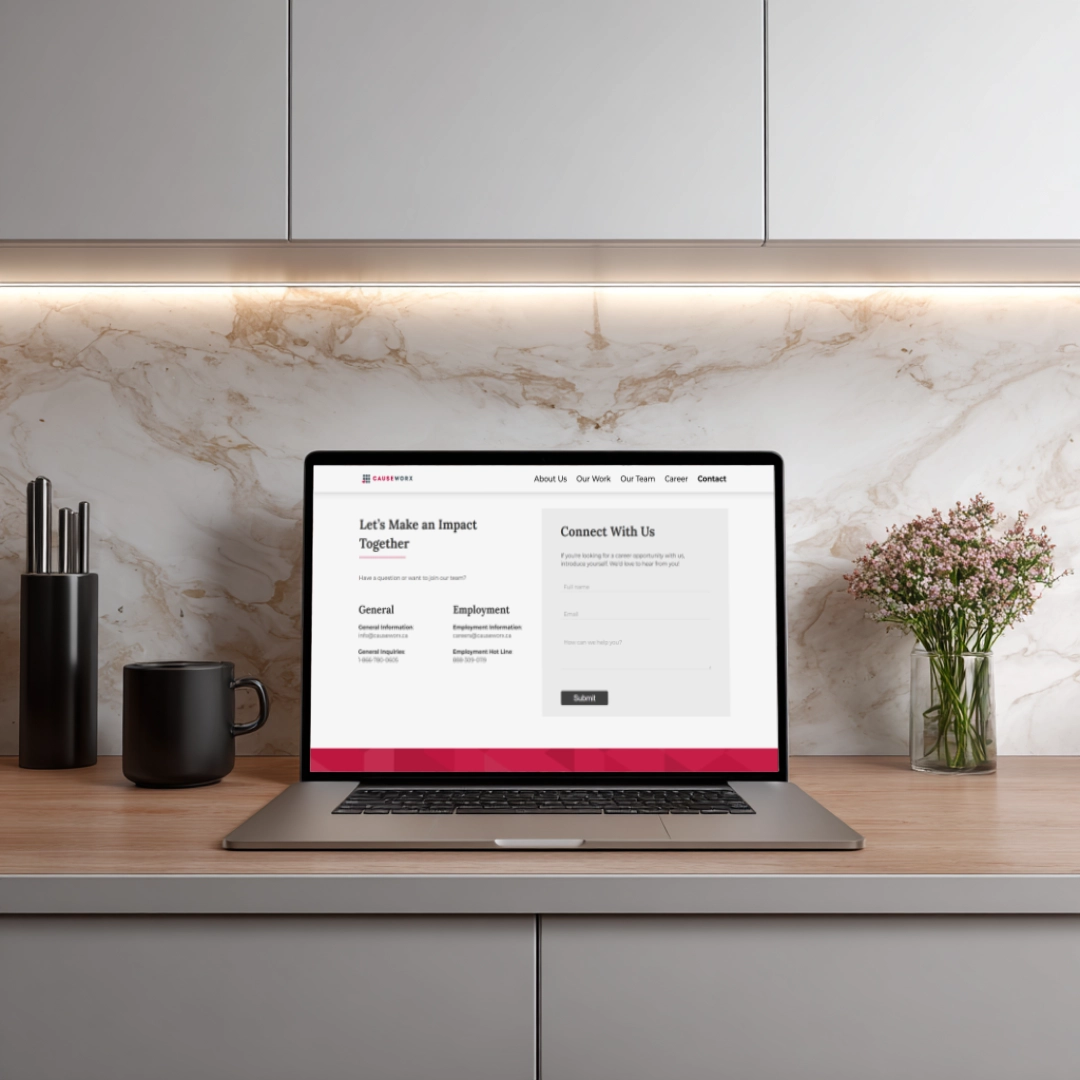 CAUSEWORX website mockup on a laptop on a kitchen counter
