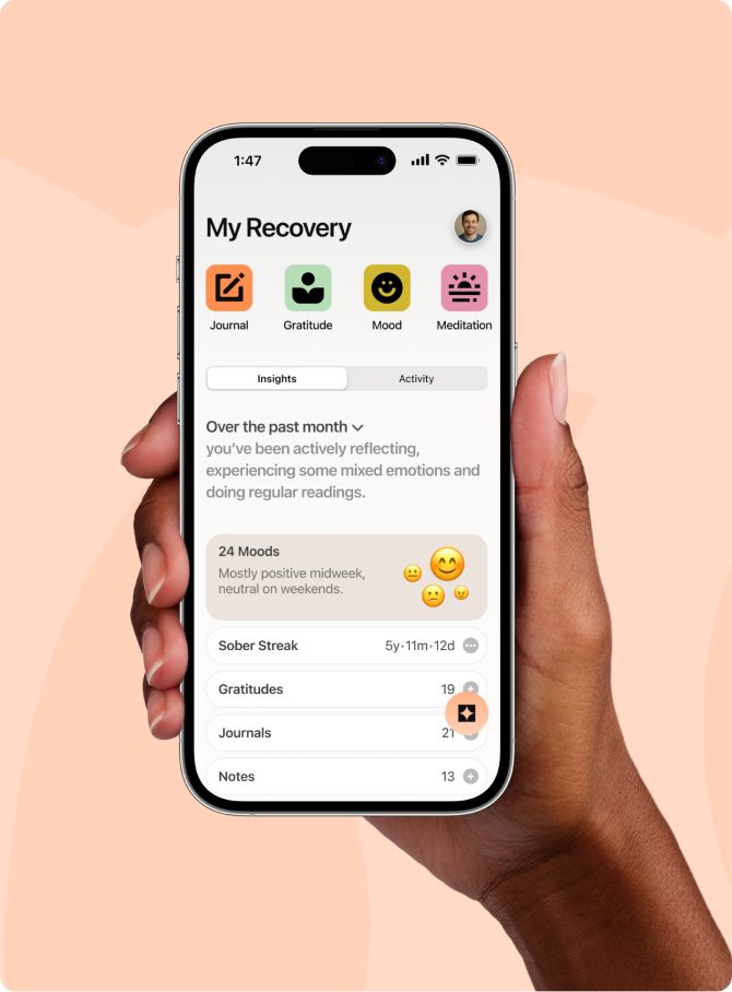 A person holding a cell phone in their hand.
