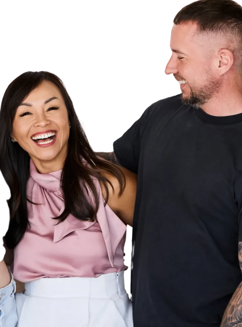 A man and a woman laughing together.