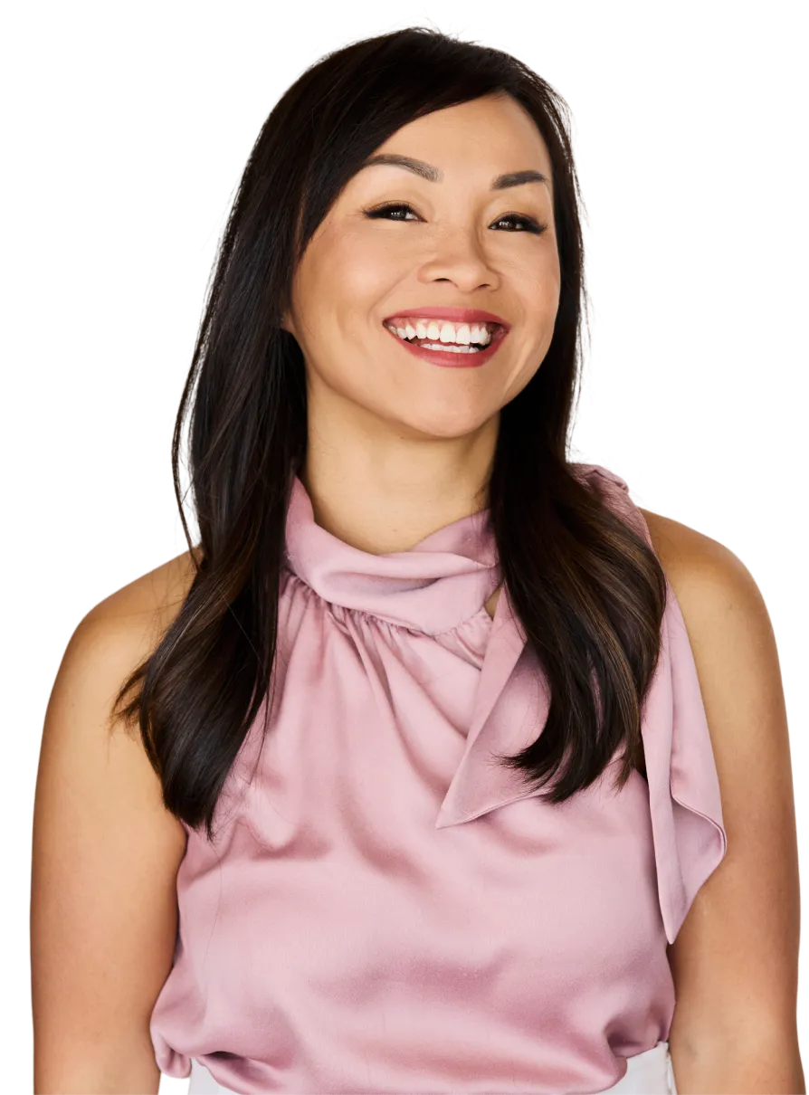 A smiling woman in a pink top.