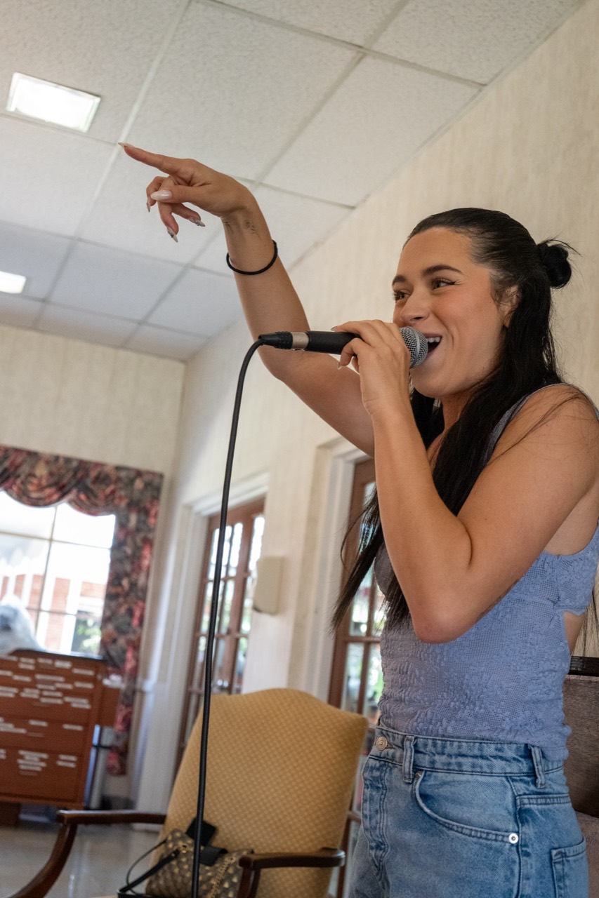 Express Entertainment vocalist bringing energy to a Senior Living performance