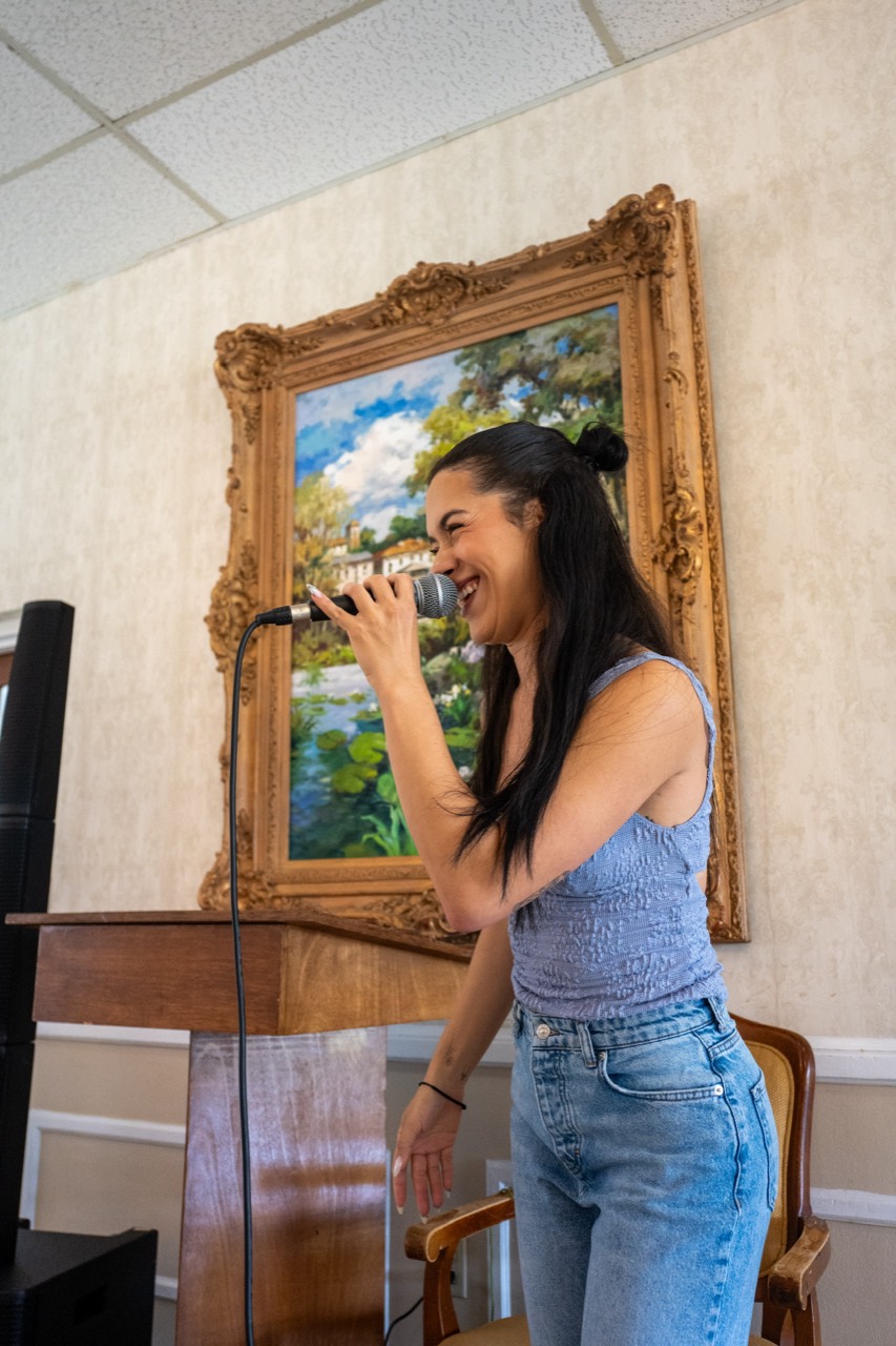 Vocalist performing in an elegant Senior Living event setting