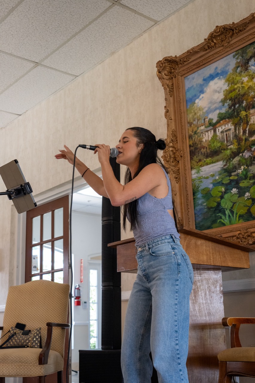 Performer engaging directly with residents during an Express Entertainment Senior Living event