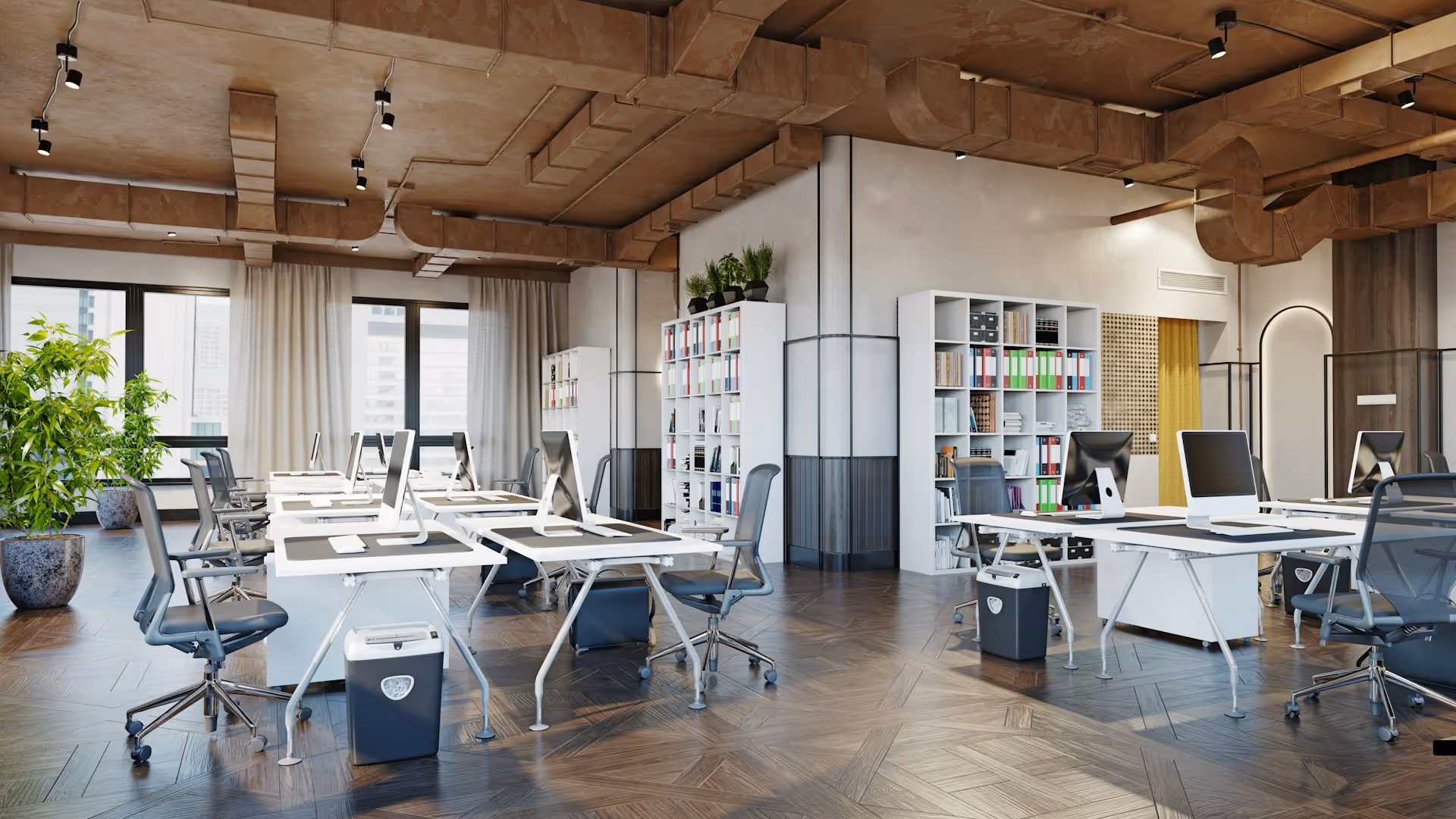 A modern, open-plan office with rows of white desks, ergonomic chairs, and computers