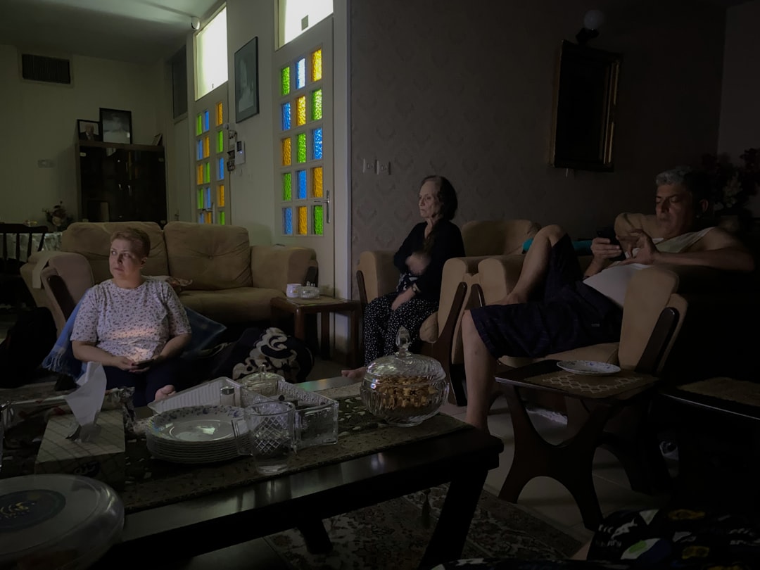 family relaxing comfortably in living room - heating repair chandler az