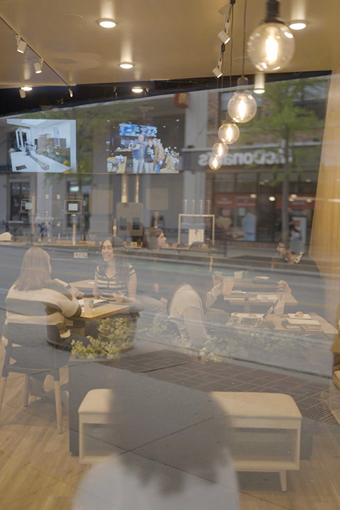 A group of people sitting at a table in a restaurant.