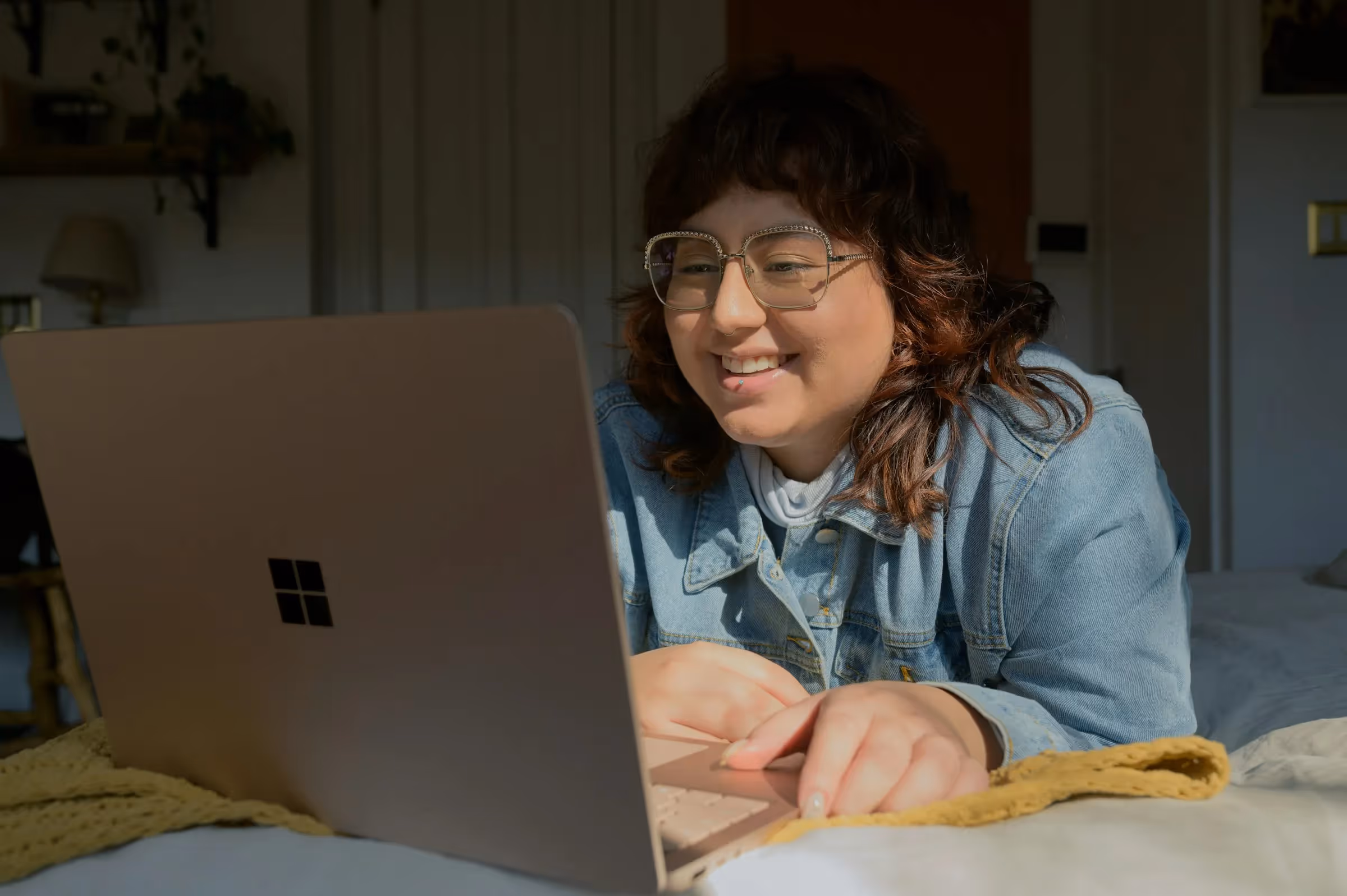 woman on a laptop - Prop Firm Challenges