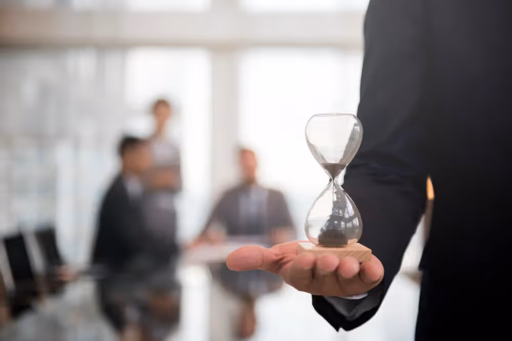 man holding a sand clock - Best Time Frame for Day Trading