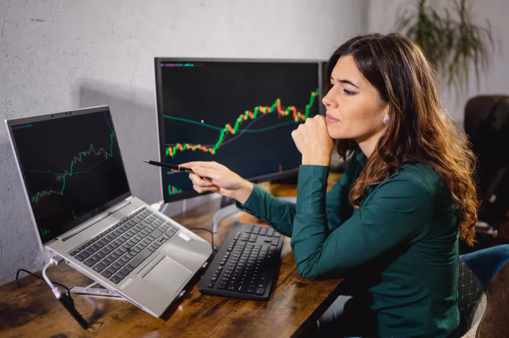 woman looking at a laptop - How Many Day Traders Are Successful