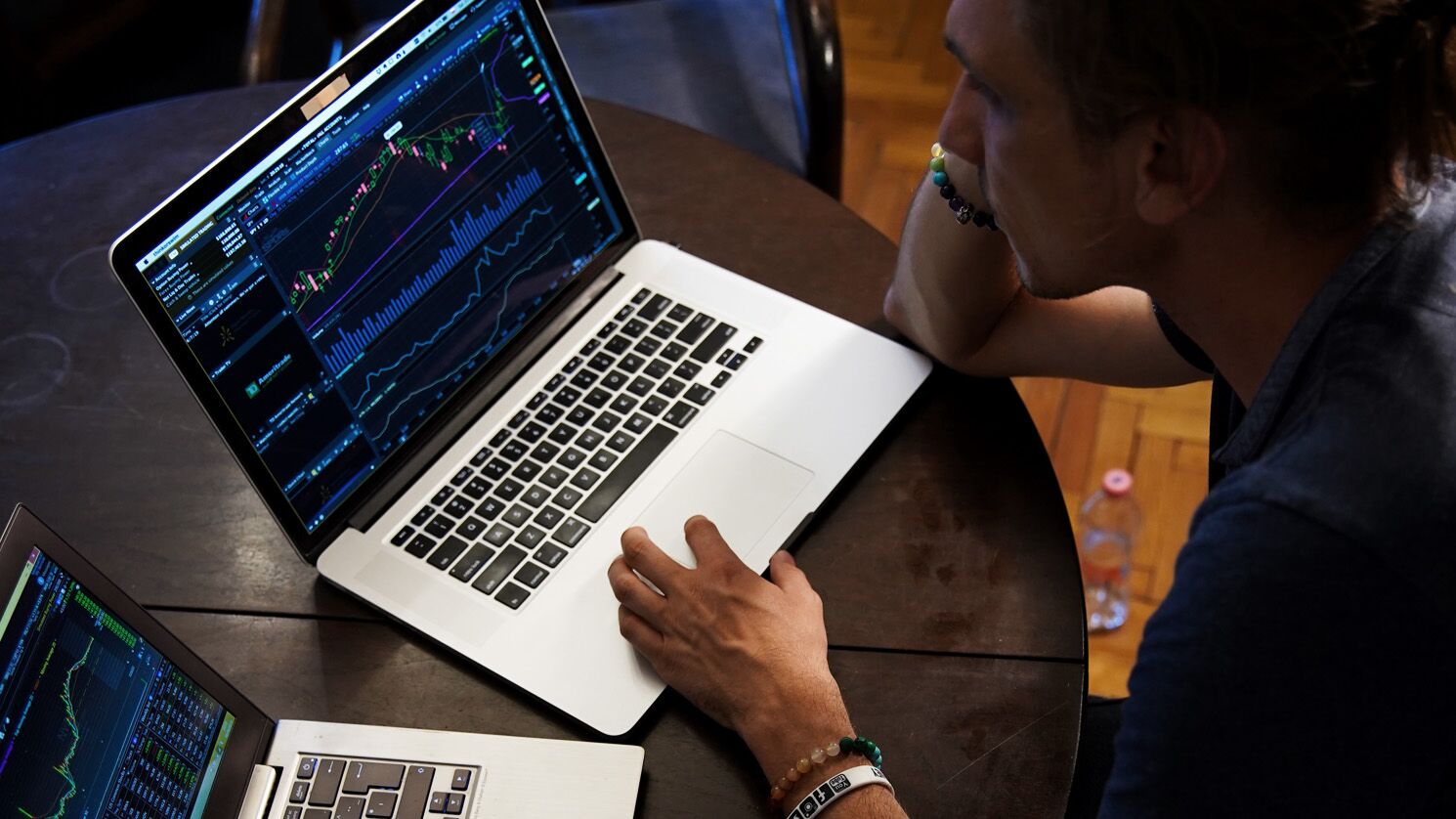 man trading on a laptop - Is Day Trading A Good Side Hustle