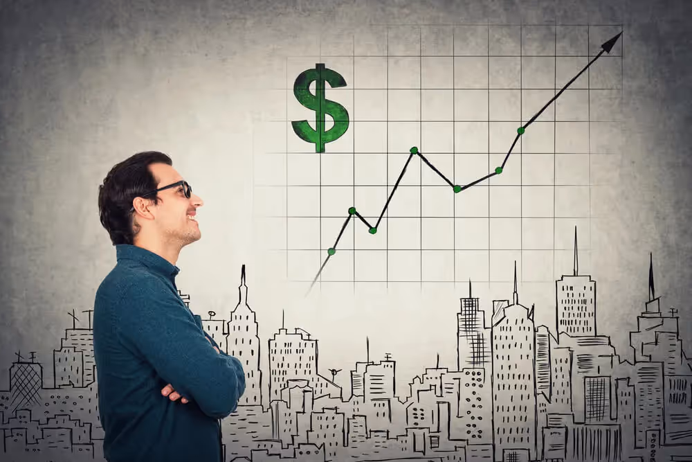 man looking at a trading chart - Day Trading Goals