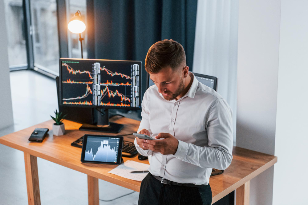 man using a phone - Margin vs Leverage