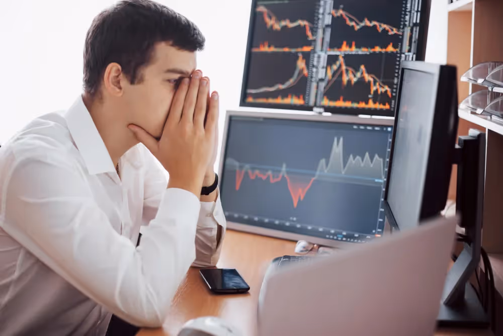 trader looking upset - What Challenges Do Traders Face