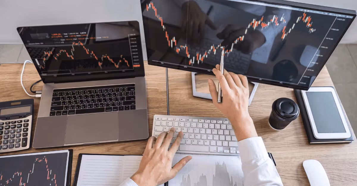 Trader pointing at stock market chart - Forex Trading Brokers 