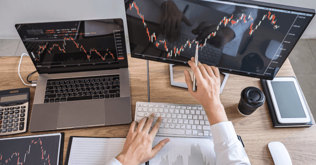 Trader pointing at stock market chart - Forex Trading Brokers 