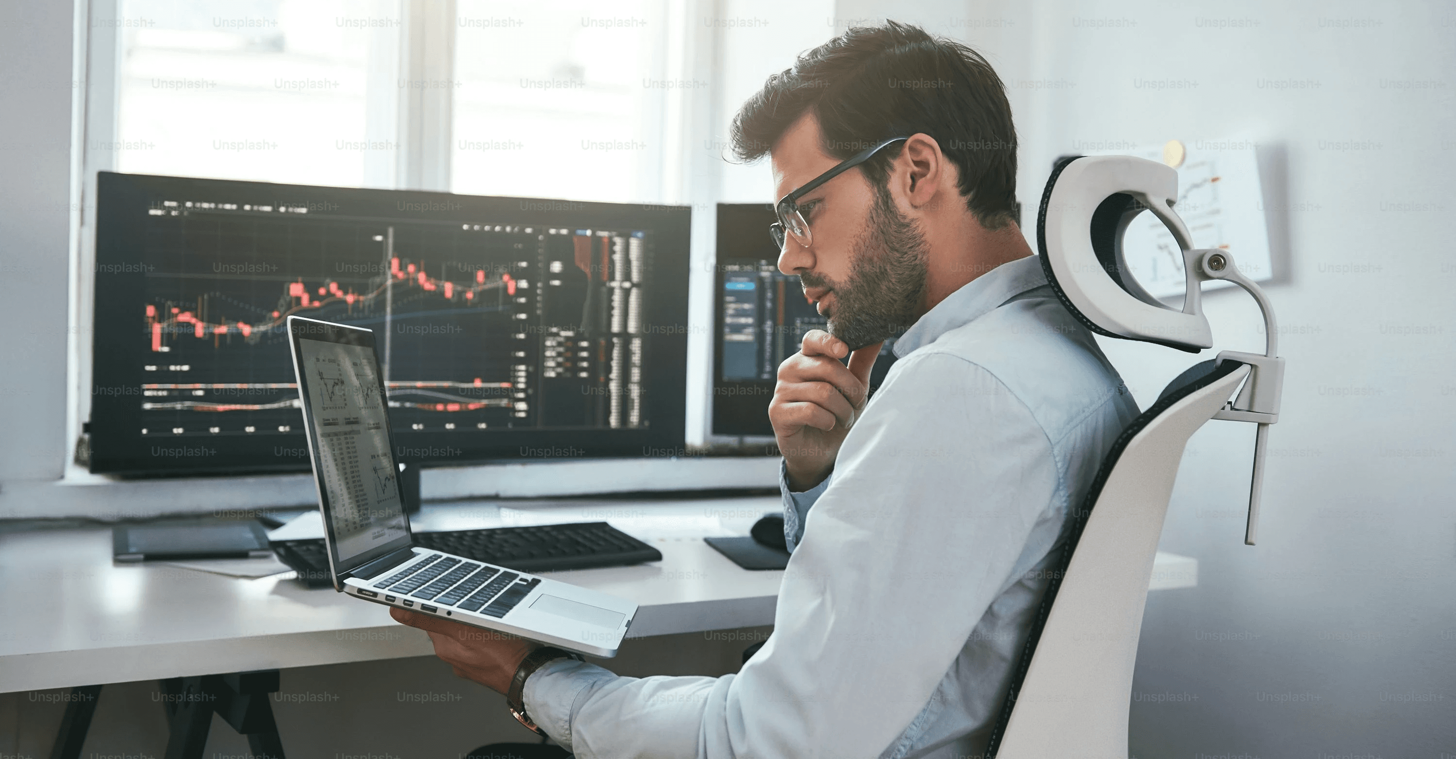  Man focused on financial market charts - What is PNL in Trading