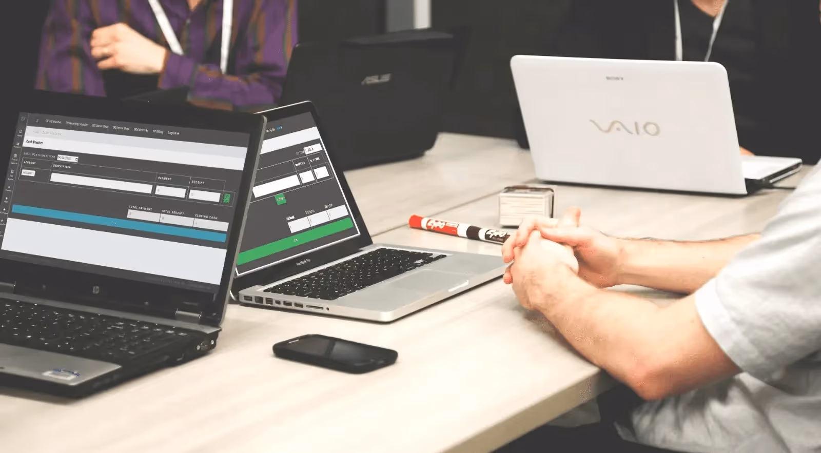 People working on laptops - What is a Cash Account in Trading