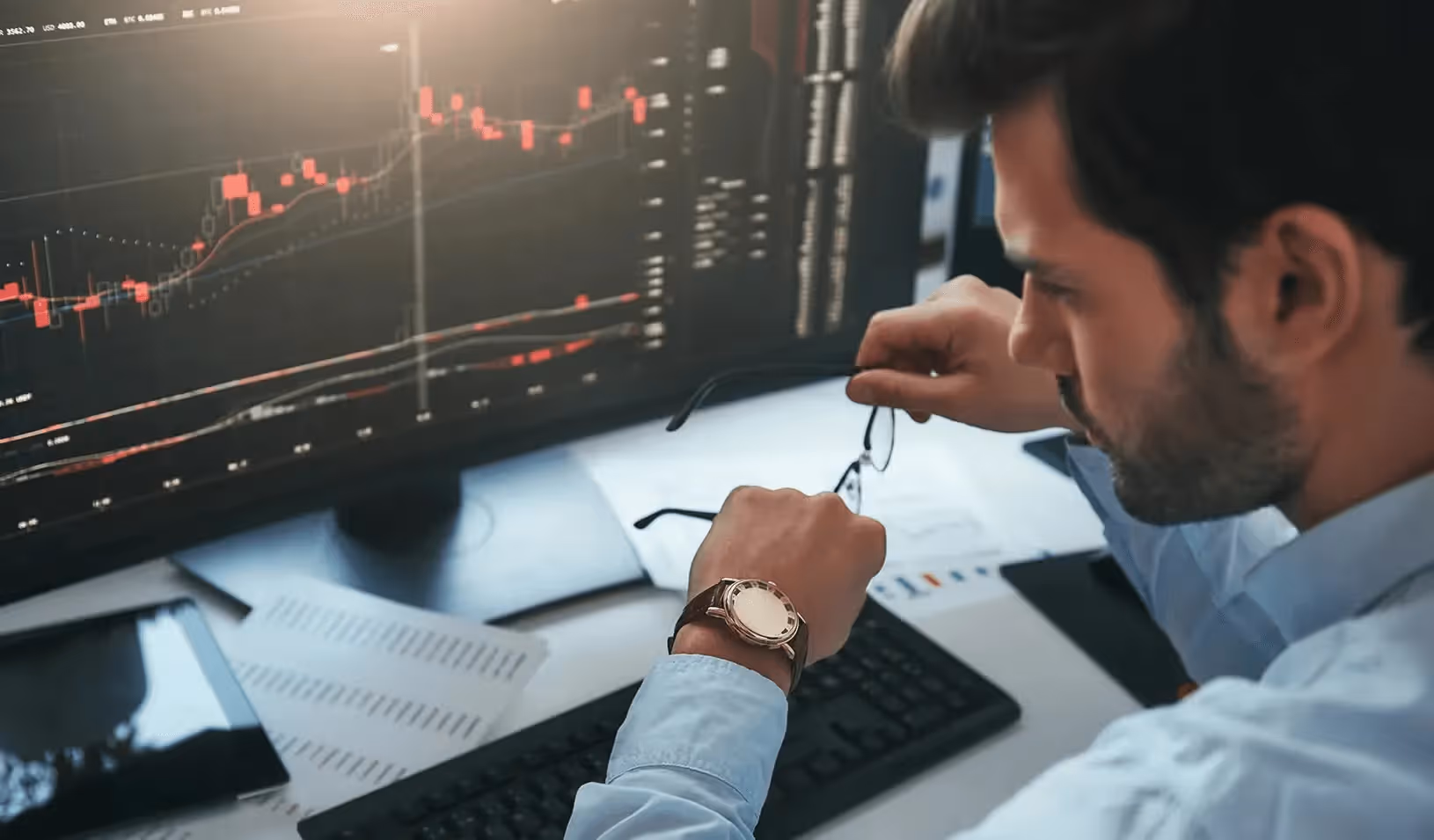 Man analyzing financial stock market charts - What is a Cash Account in Trading