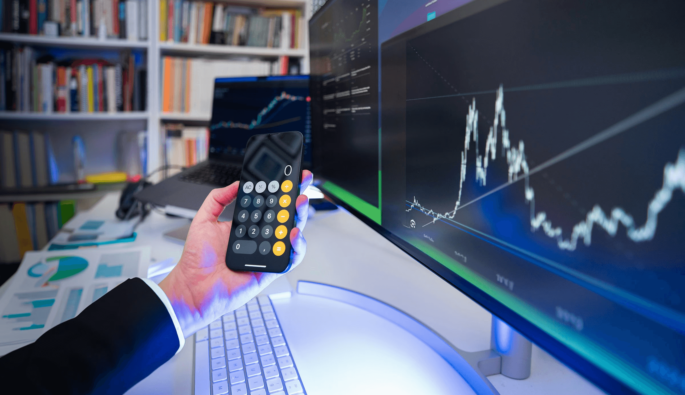 Person holding phone with calculator app - What is a Cash Account in Trading