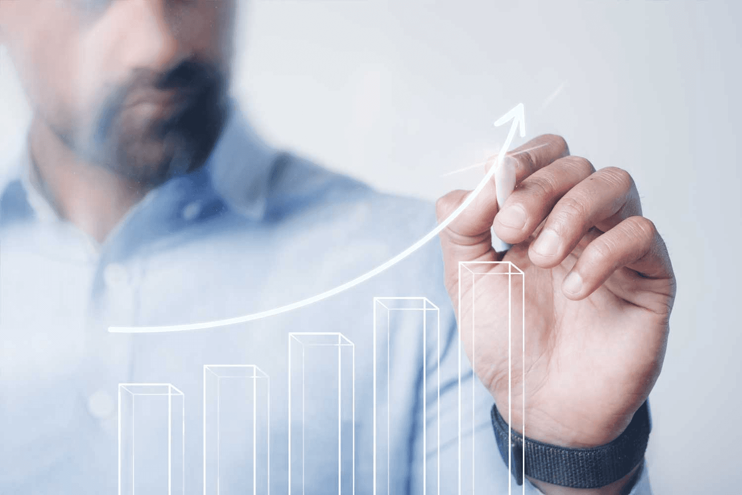 Man drawing upward arrow on graph - Capital Growth Strategy