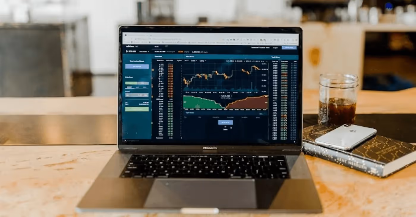  Laptop displaying financial trading charts - 