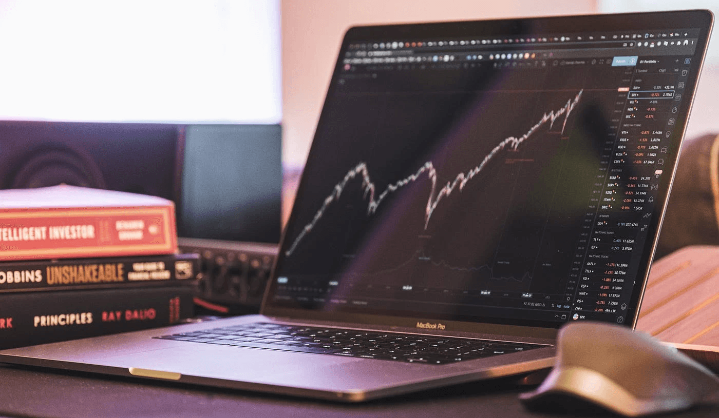Laptop displaying professional stock market trends - How to Analyze a Stock Before Buying