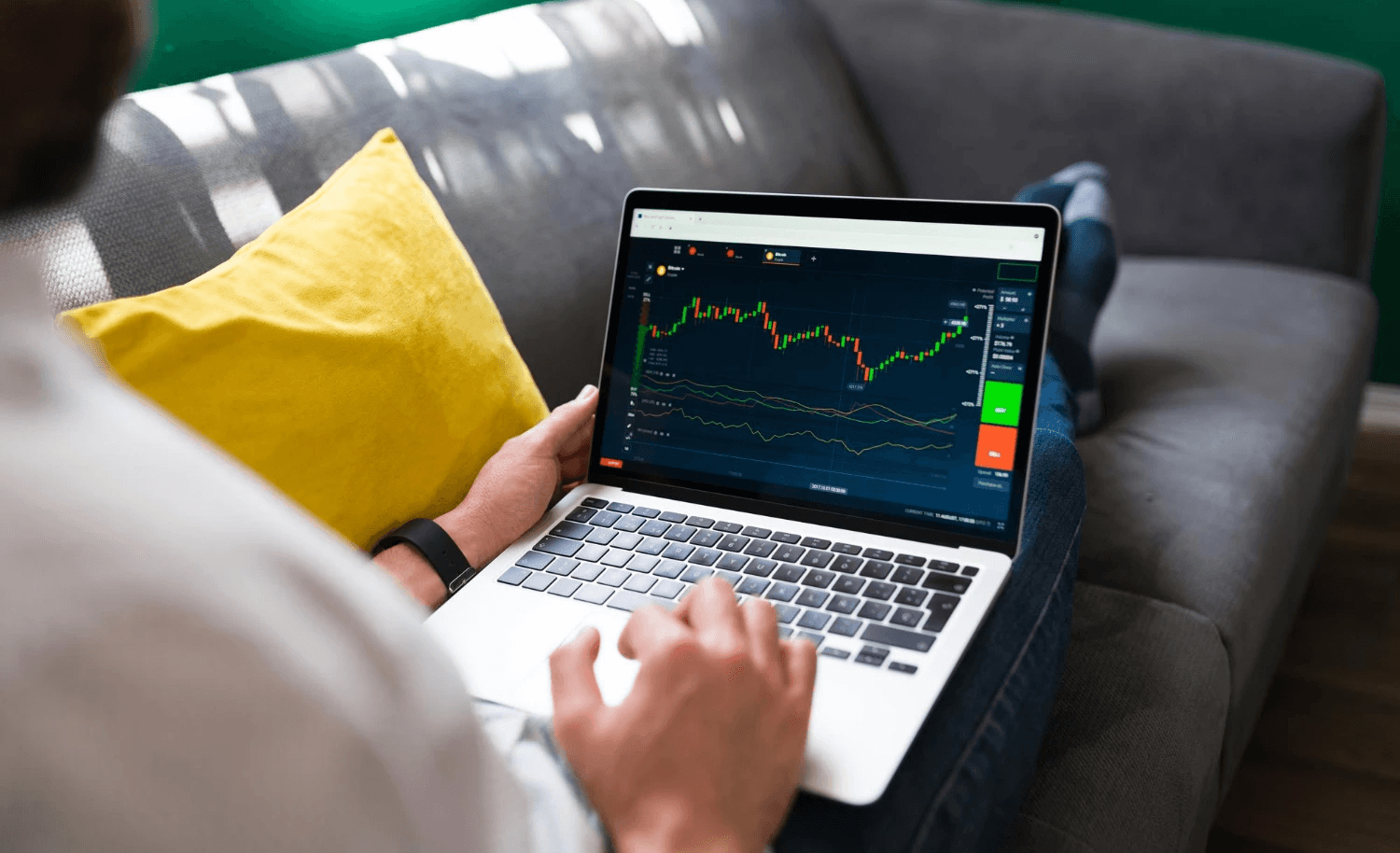 Man analyzing financial charts on laptop - What is a Retracement in Trading