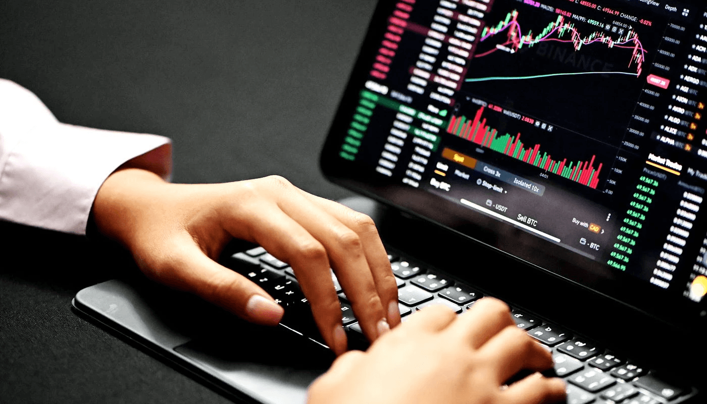 Person trading cryptocurrency on a laptop - ORB Strategy Trading