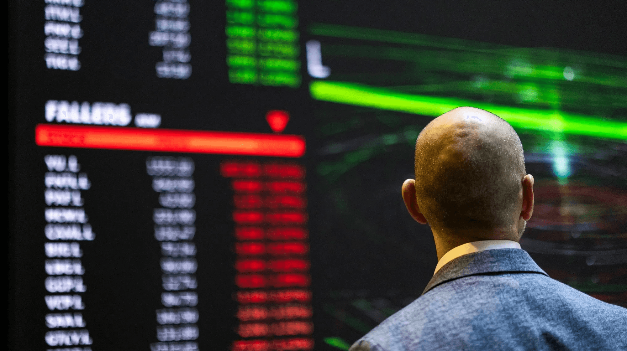  Man viewing real-time stock market data - Can You Day Trade in a Roth IRA