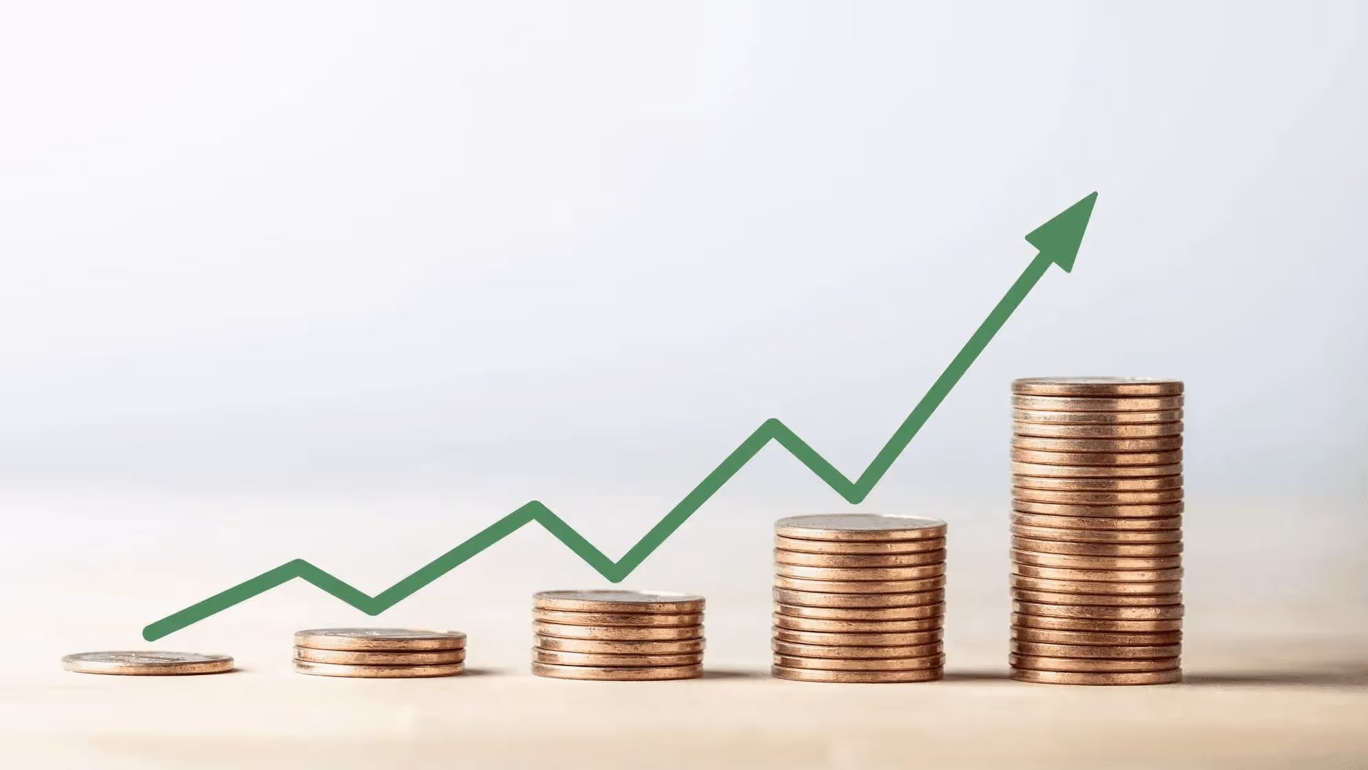 Rising coin stacks with upward arrow - What are REIT Dividends