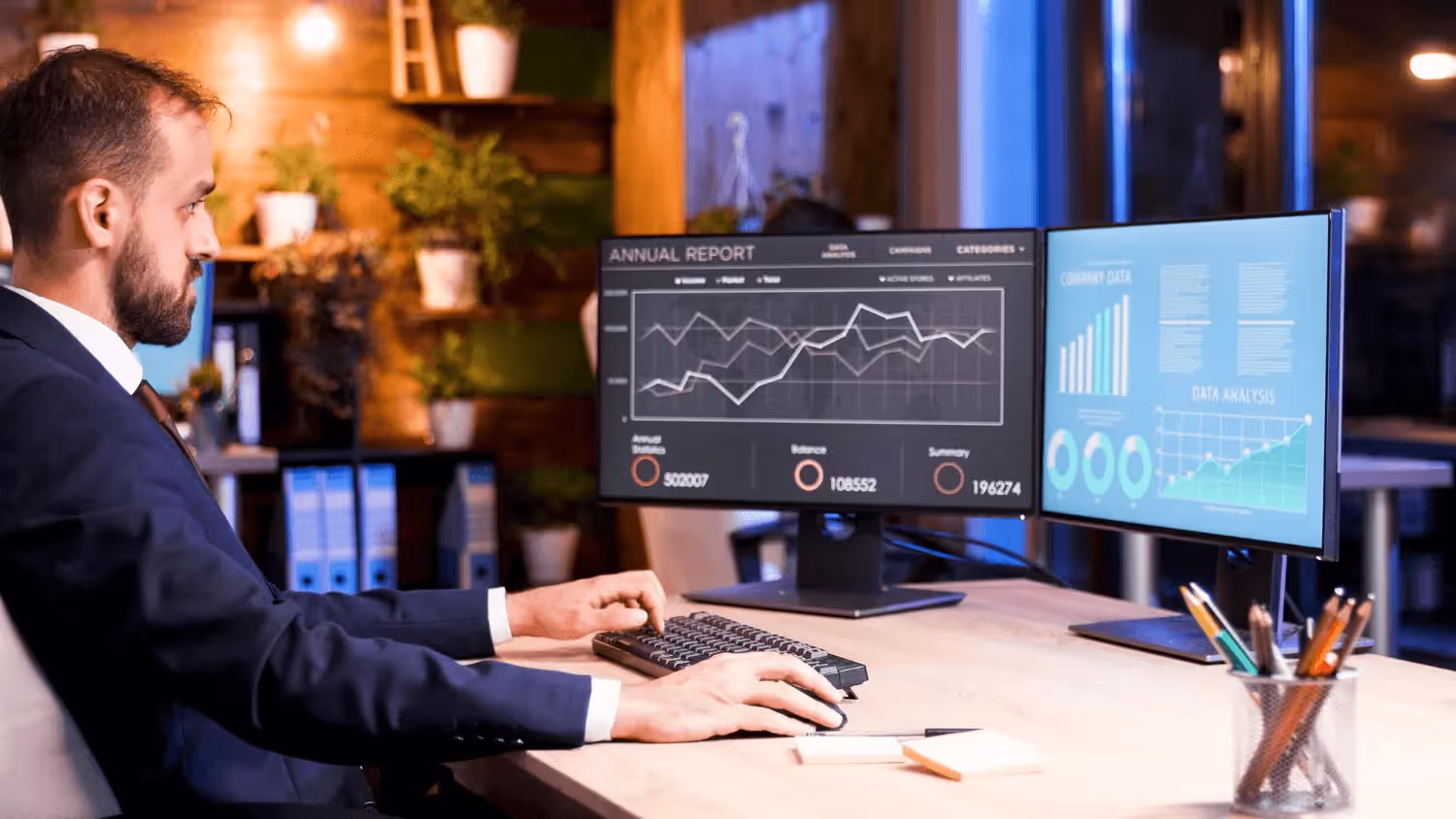 Man analyzing data on dual monitors - Trading Challenges