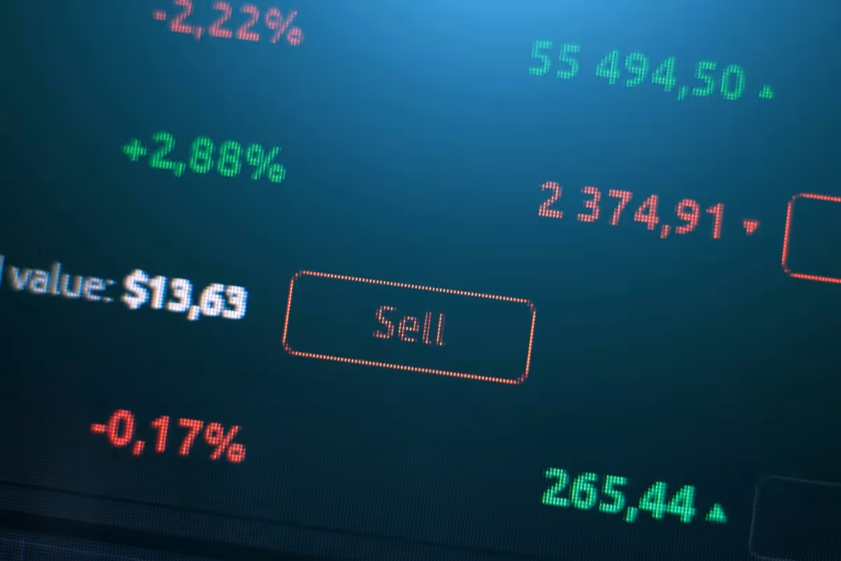 sell button on the background of exchange charts of currencies, crypto exchange