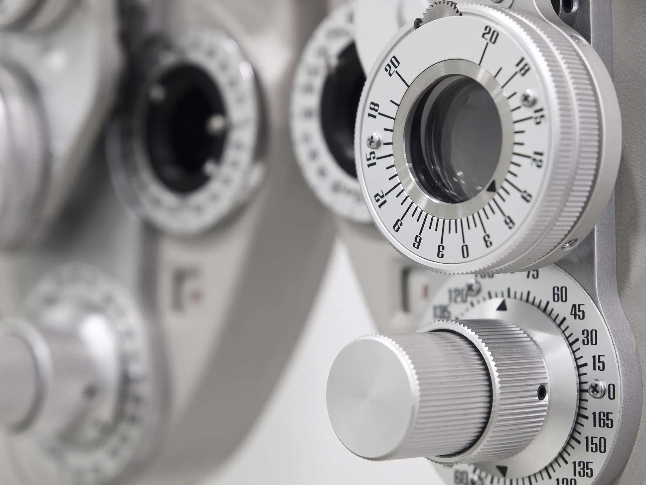 Close-up of vintage camera dials with numbered scales and settings