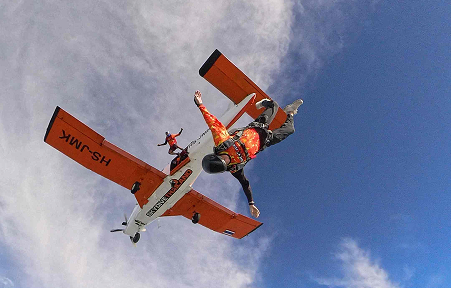 Skydiver jumping out of plane