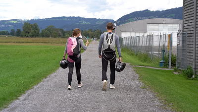 Skydivers walking to the boarding area