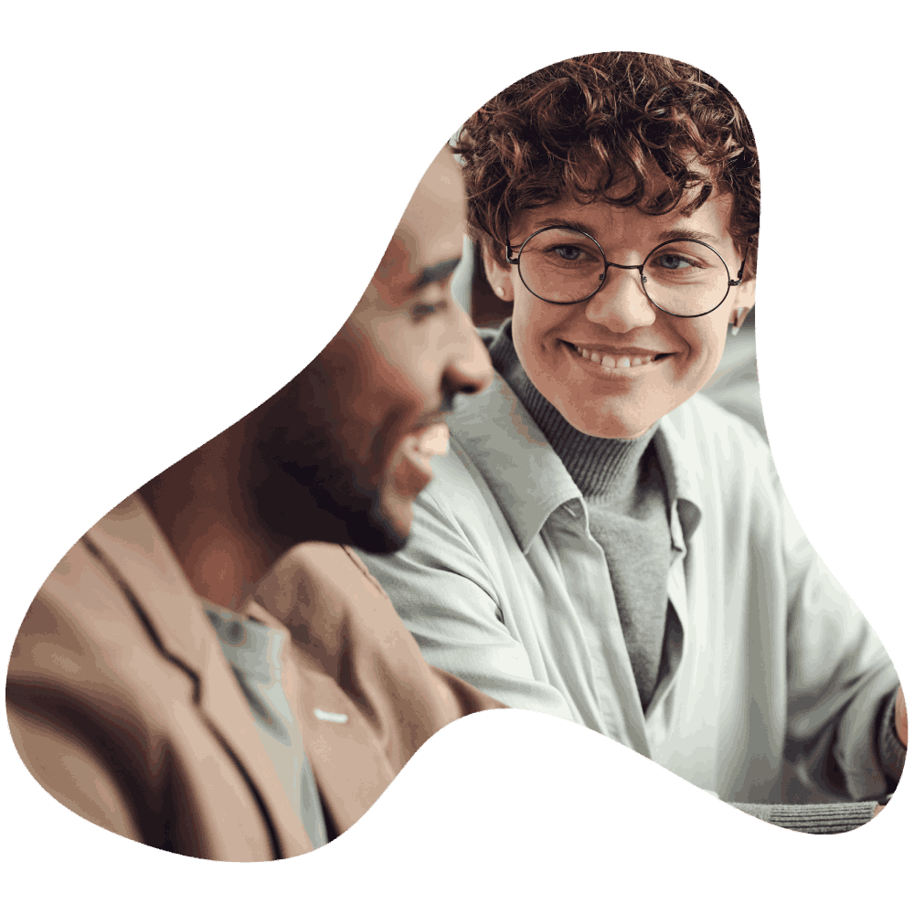 A 3 sided cutout within which is an image of a man and a woman, both smiling. 