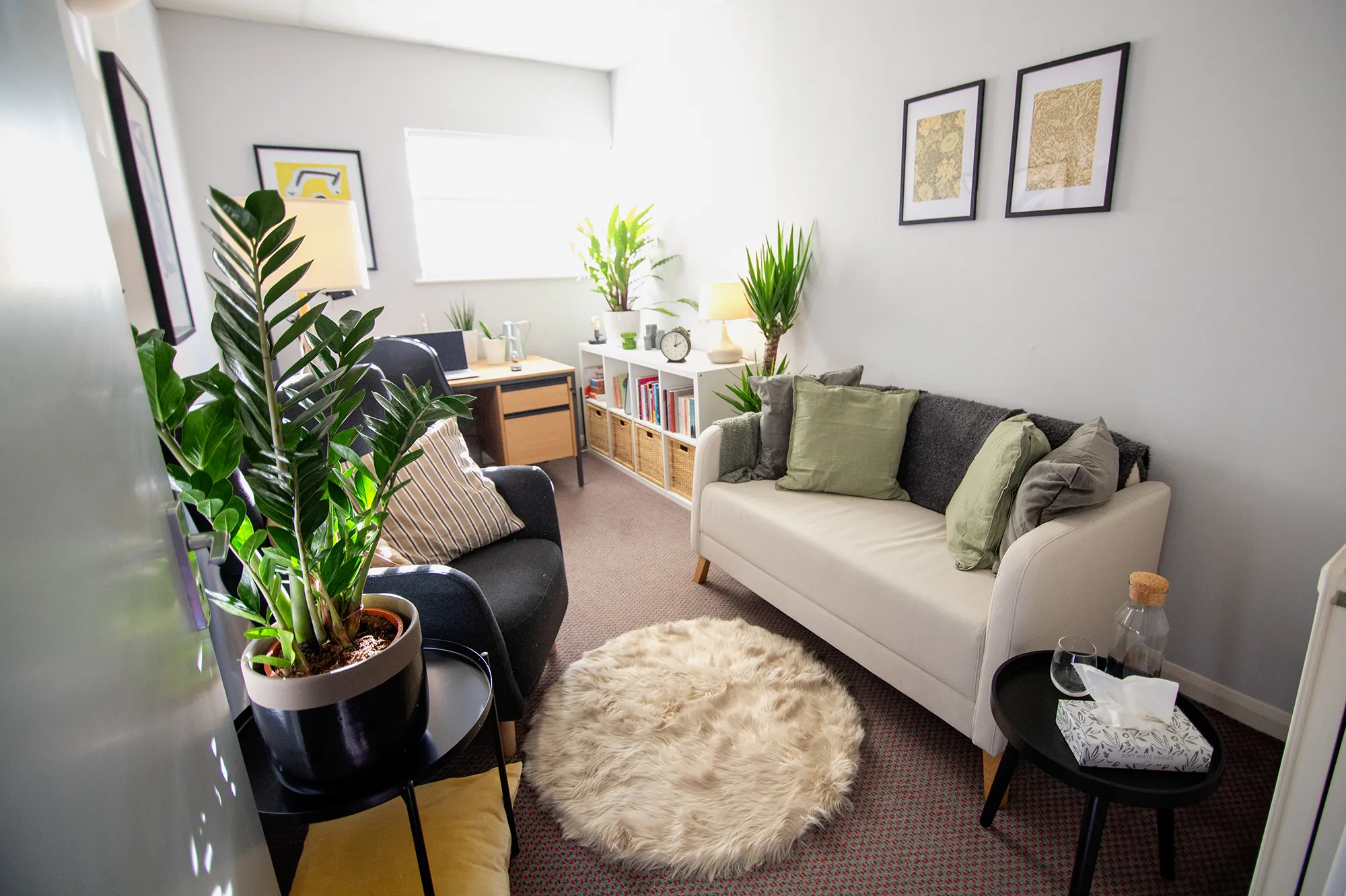 Inside the Anchor Counselling office space, showing cosy furniture and different wall decorations. 