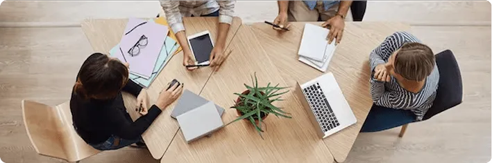 office round table with four female staff
