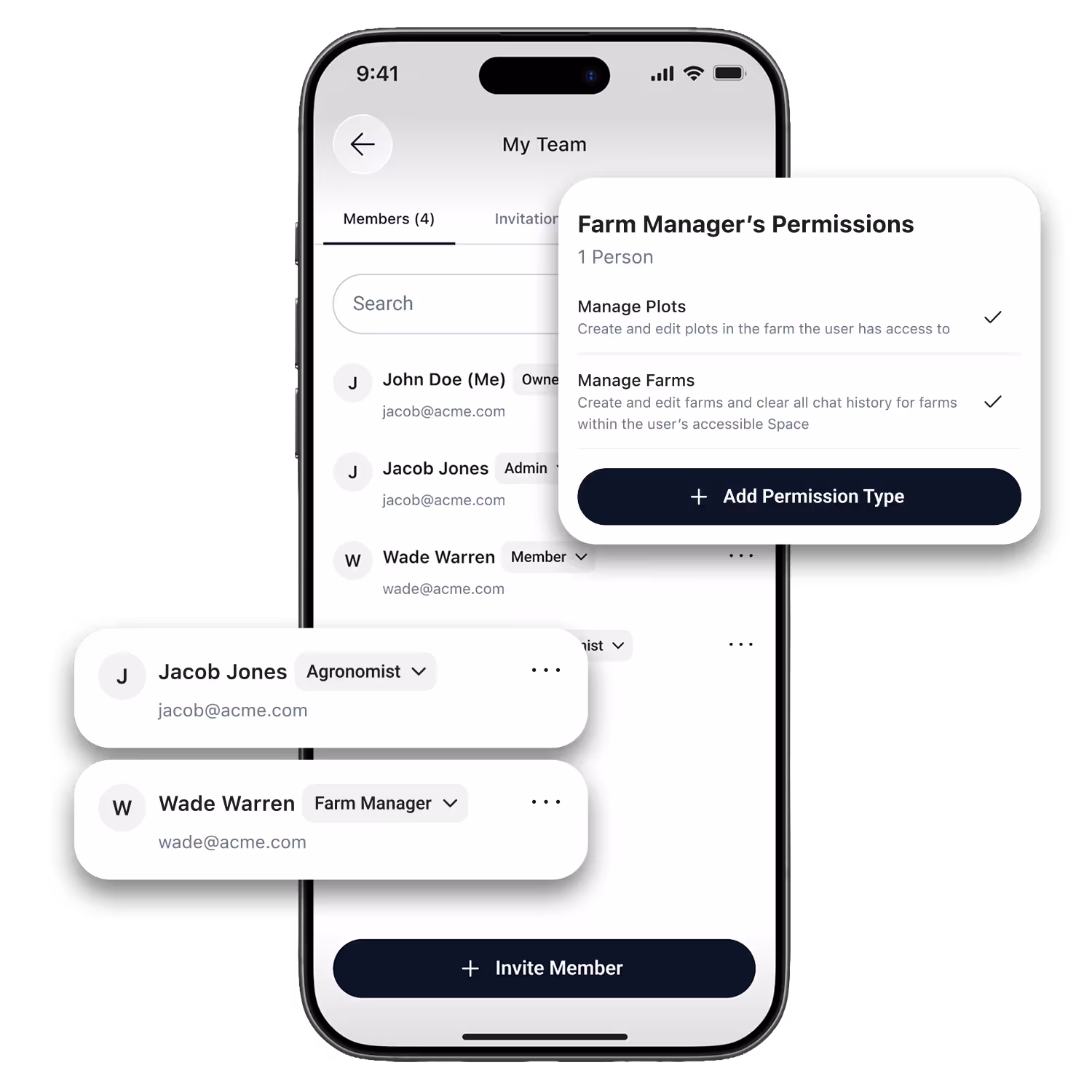 Four farmers standing in a field at sunset, smiling and looking at their smartphones together.