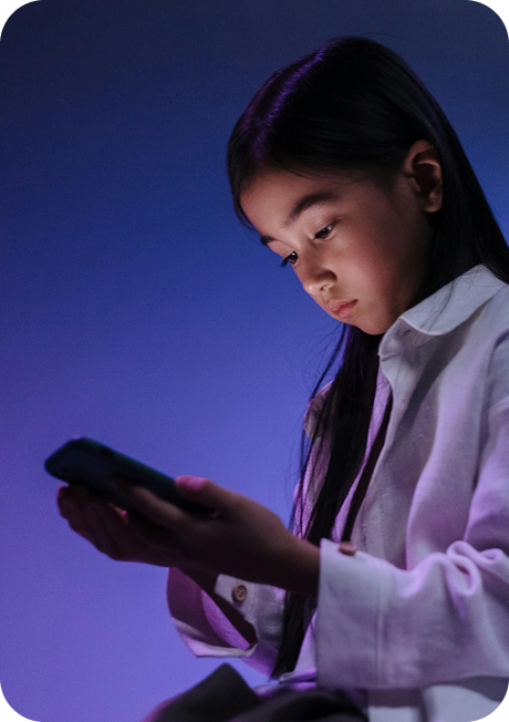 A child viewing something on their phone