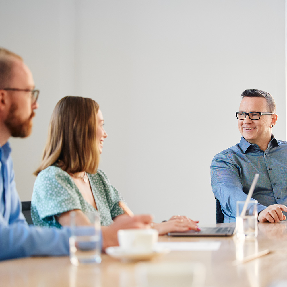 Three people in a meeting