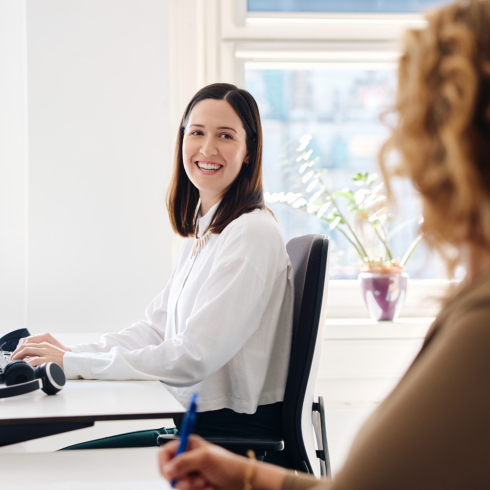 Two people working in an office.