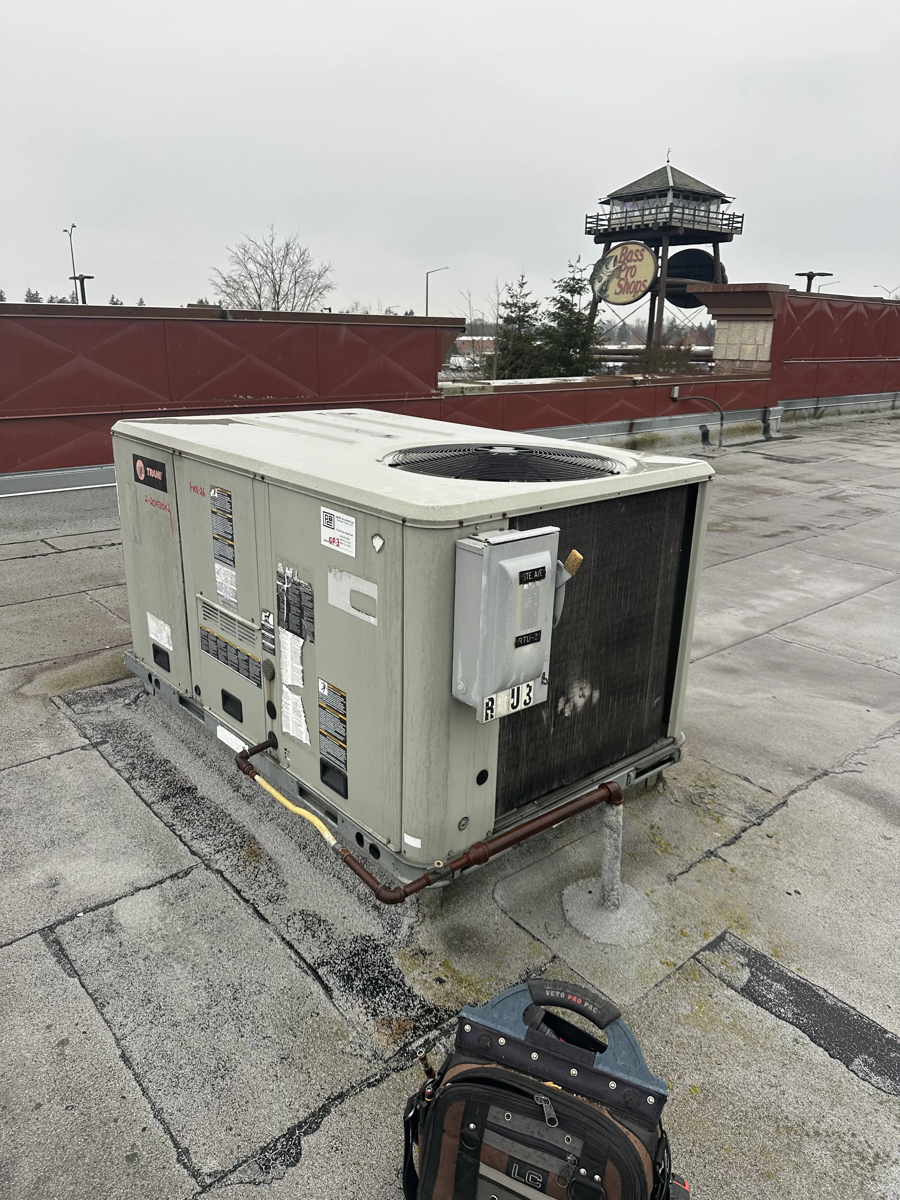 Rooftop HVAC unit on a commercial building near Bass Pro Shops, ready for maintenance or inspection.
