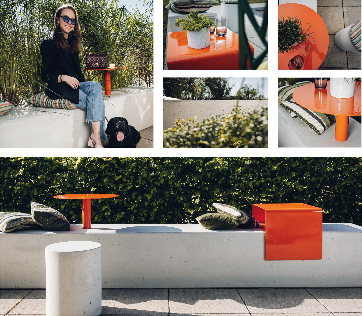 Woman with sunglasses sitting on concrete bench with dog by orange table and green hedge background.