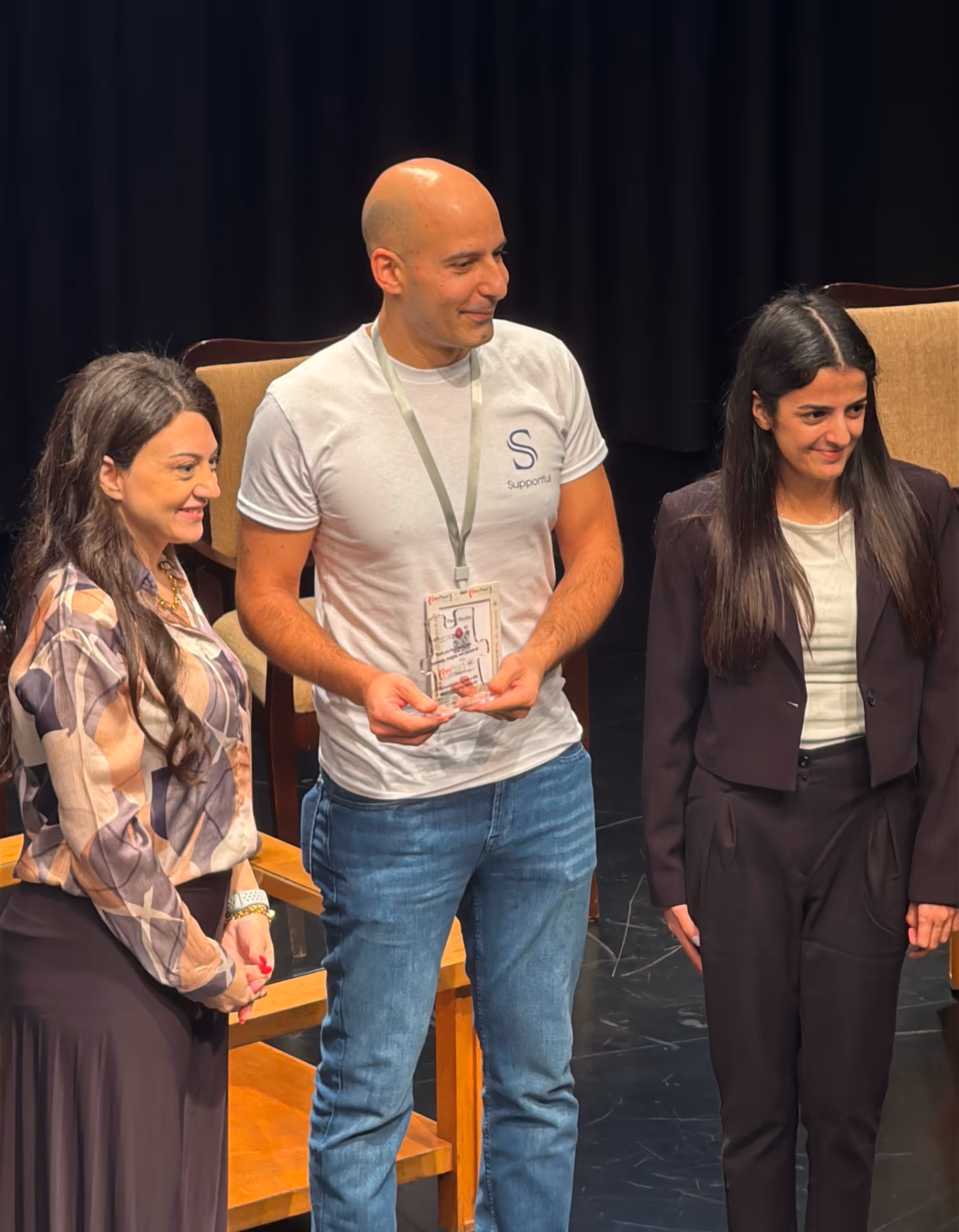 Supportful Founder and ceo holding an award