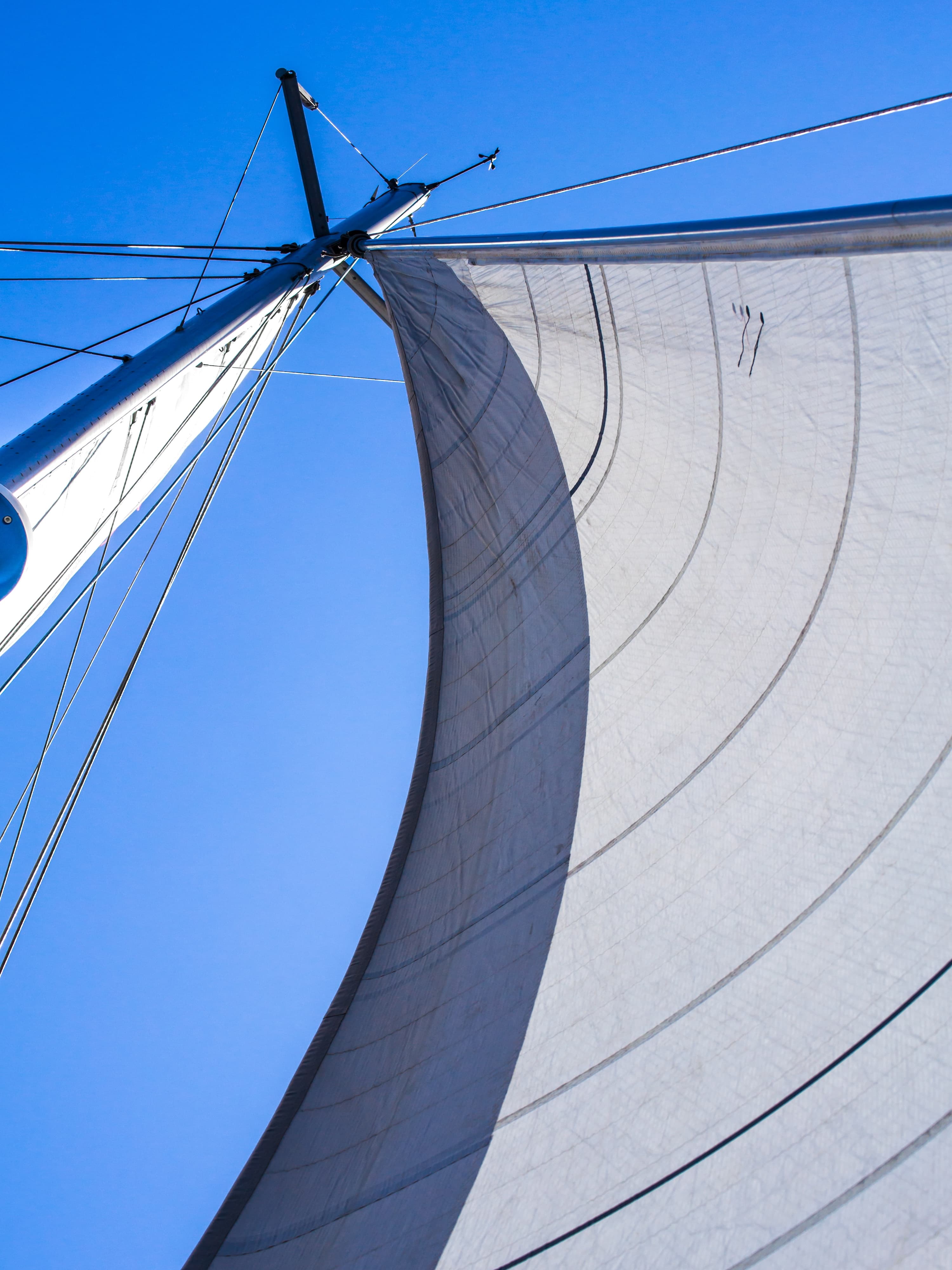 Ocean breeze filling the sails — movement and light sailing photography by Maison TALI.
